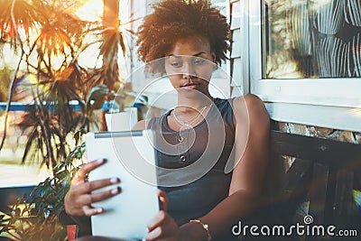 Black charming girl taking selfie on digital pad Stock Photo